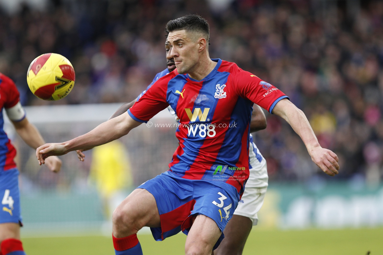 Martin Kelly #34 of Crystal Palace and Omar Bogle #7 of Hartlepool United compete for the ball