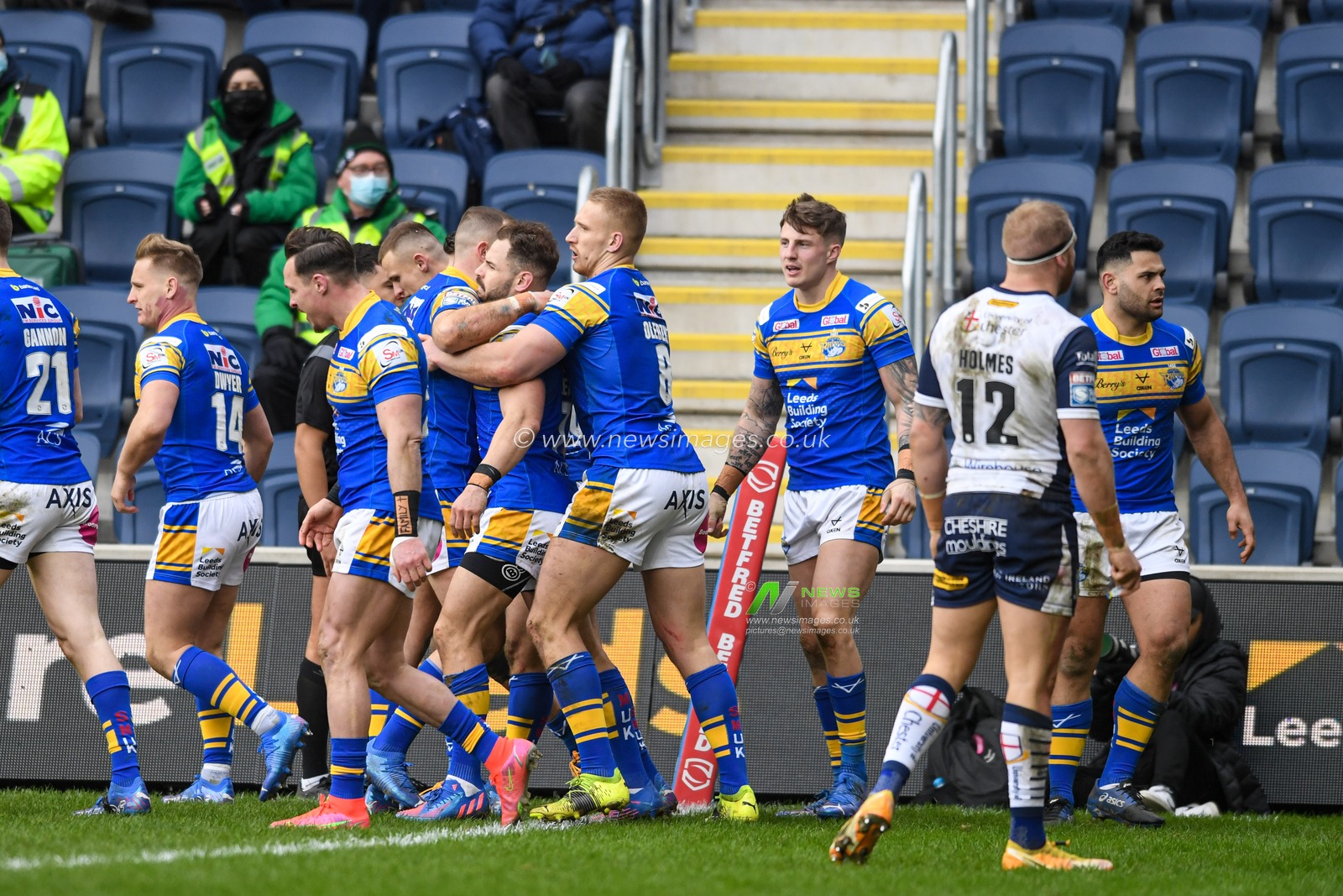Ash Handley #5 of Leeds Rhinos celebrates scoring a try with his team mates to make it 16-10