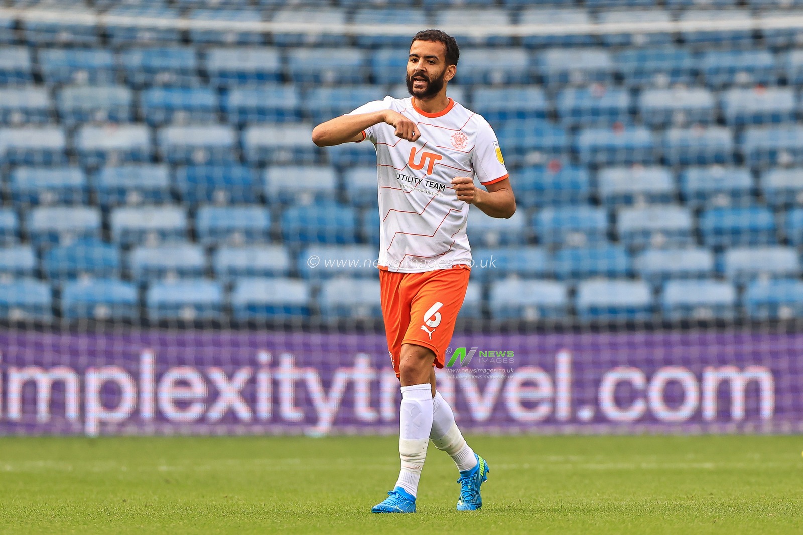 Kevin Stewart #6 of Blackpool gives his team instructions