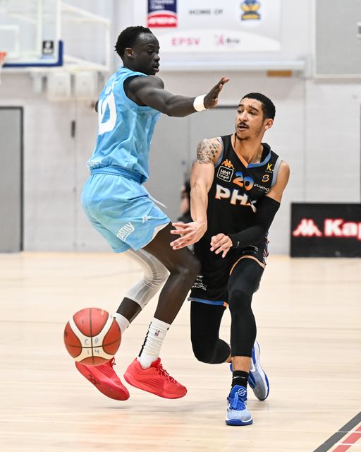 EJ Stephens of Cheshire Phoenix passes the ball despite pressure from Padiet Wang of Surrey Scorchers during the British Basketball Championship match Cheshire Phoenix vs Surrey Scorchers at Ellesmere Port Sports Village, Ellesmere Port, United Kingdom, 19th November 2023

(Photo by Craig Thomas/News Images)