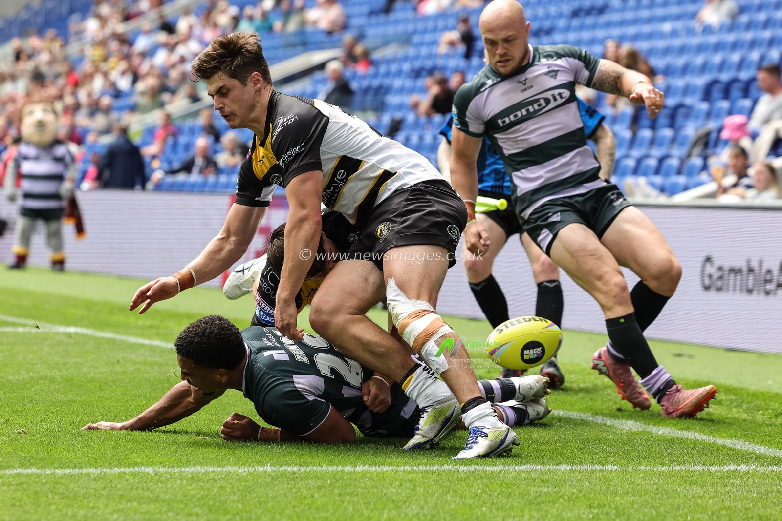 Tanguy Zenon of Huddersfield Giants is stopped from going over in the corner by Scott Galeano of York Knights and Jon Bennison of York Knights during the Betfred Super League Magic Weekend match Huddersfield Giants vs York Knights at Hill Dickinson Stadium, Liverpool, United Kingdom on 04 July 2026

(Photo by Mark Cosgrove/News Images)