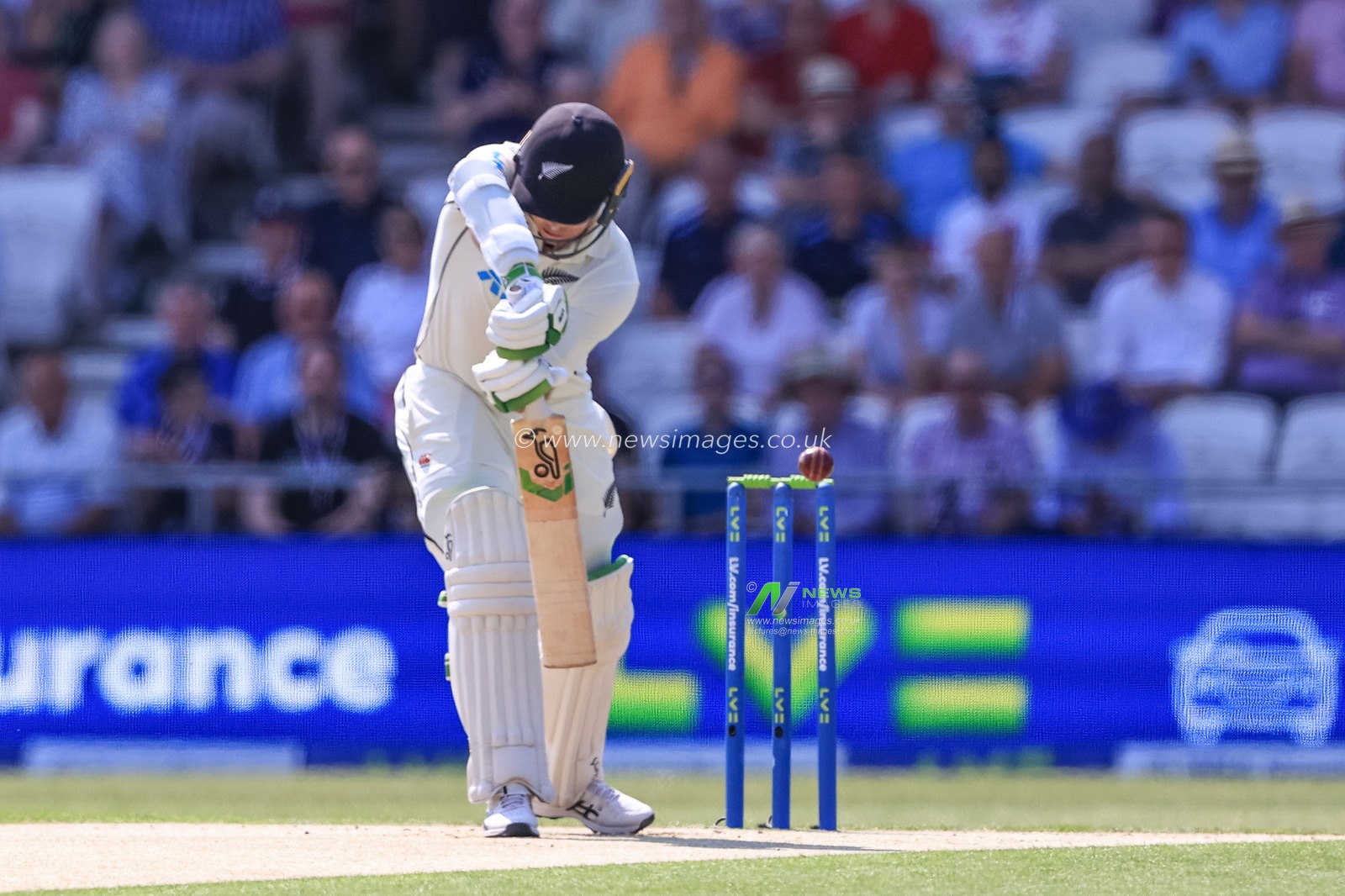 Tom Latham of New Zealand clips the ball and is caught by Joe Root of England