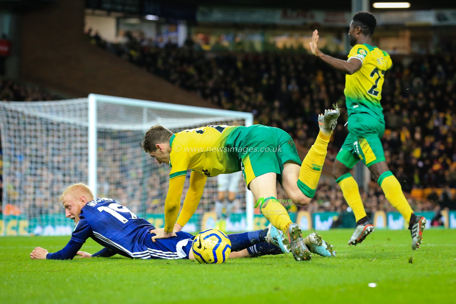 8th November 2019, Carrow Road, Norwich, England; Premier League, Norwich City v Watford : Will Hughes (19) of Watford and Kenny McLean (23) of Norwich City collide

Credit: Georgie Kerr/News Images