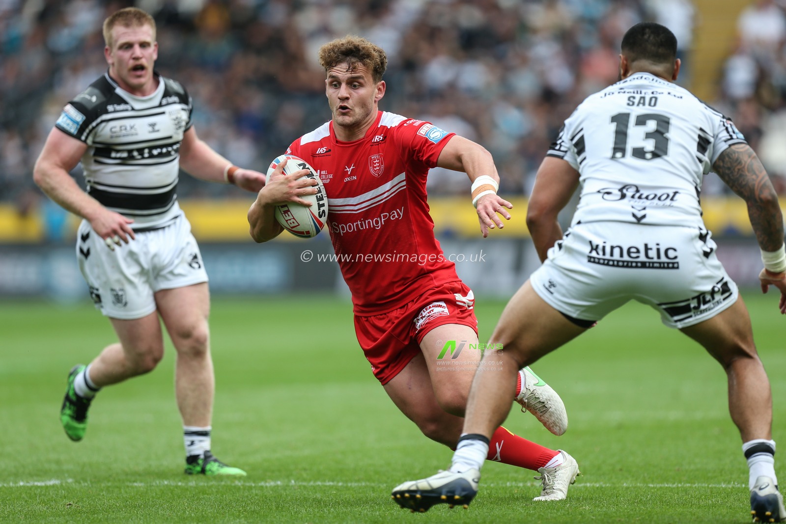George Lawler (15) of Hull KR runs with the ball