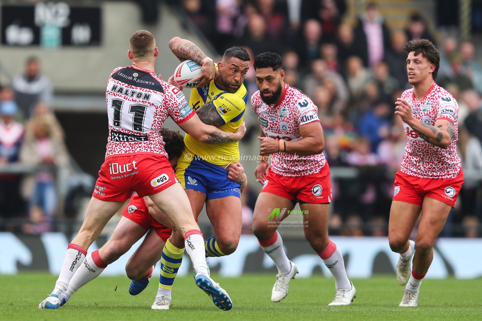 Paul Vaughan of Warrington Wolves is tackled during the Betfred Super League Round 8 match Leigh Leopards vs Warrington Wolves at Leigh Sports Village, Leigh, United Kingdom, 19th April 2025

(Photo by Gareth Evans/News Images)