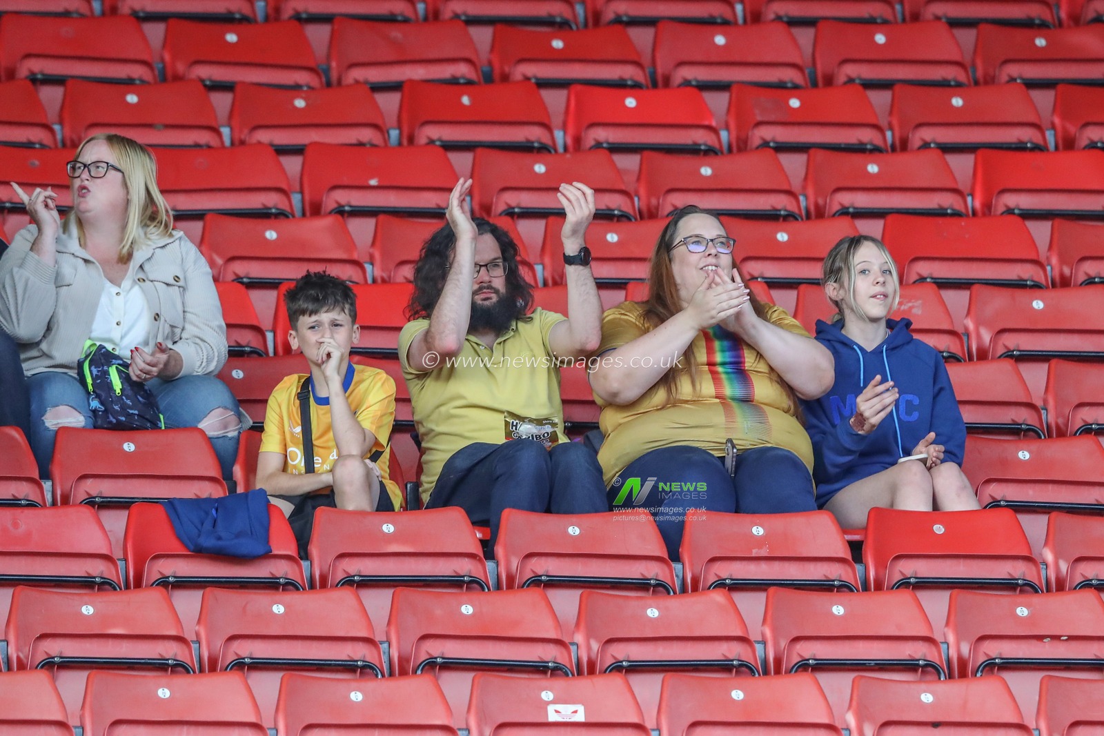 Mansfield fans applaud their team as they begin to arrive during the Sky Bet League 1 match Barnsley vs Mansfield Town at Oakwell, Barnsley, United Kingdom, 9th August 2024

(Photo by Alfie Cosgrove/News Images)