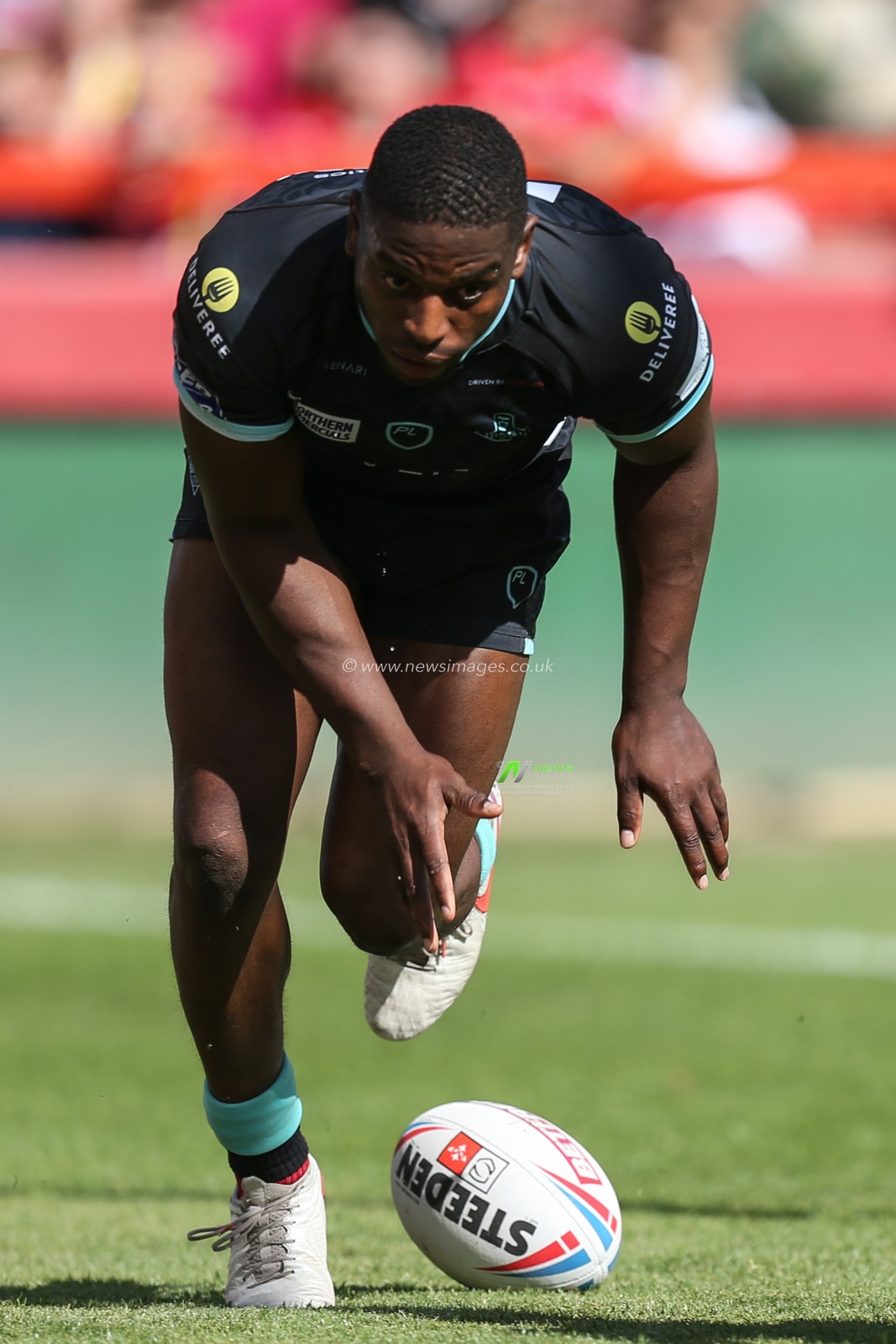 Jermaine McGillvary #2 of Huddersfield Giants goes over for a try which is his 200th Super League try
