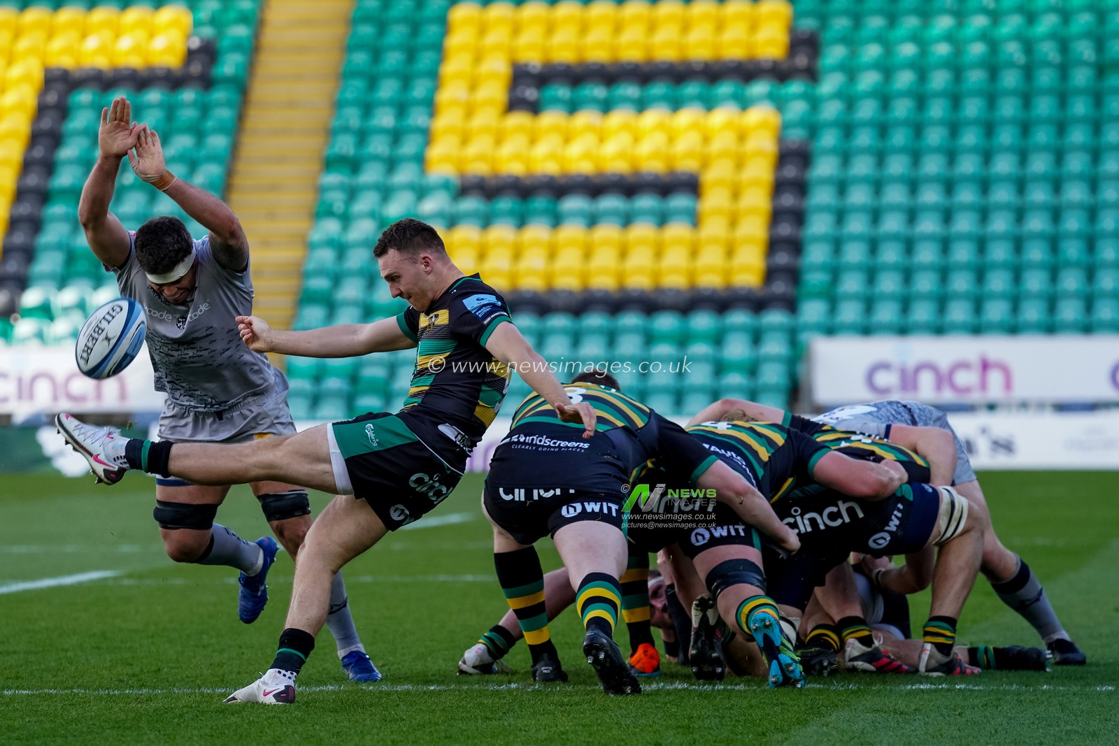 Tom James #9 of Northampton Saints kick is intercepted by  Jono Ross #7 of Sale Sharks