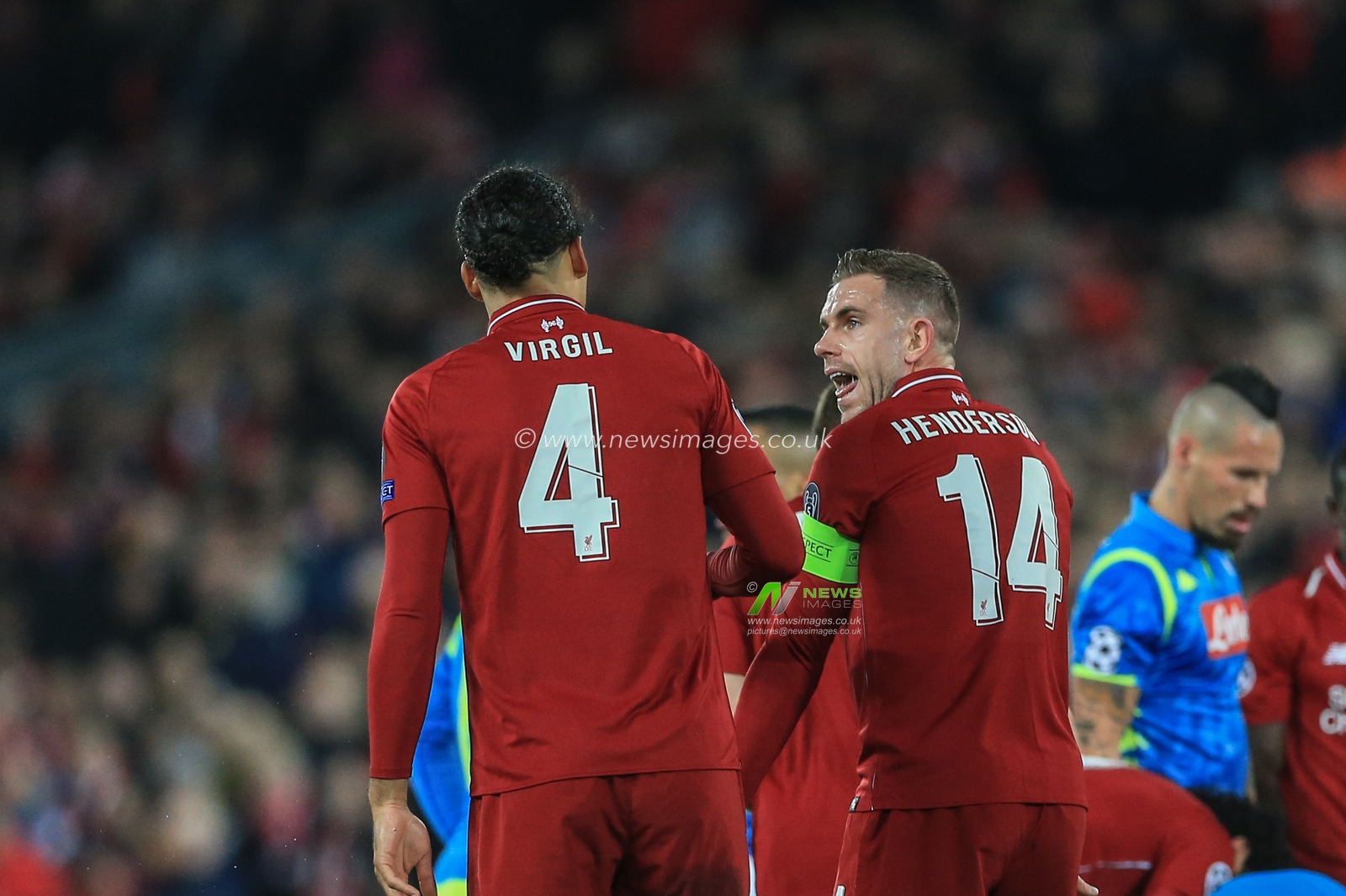 11th December 2018, Anfield, Liverpool, England; UEFA Champions League, Liverpool v Napoli ; Jordan Henderson (14) of Liverpool gives Virgil van Dijk (04) of Liverpool a telling off for the heavy tackle on Dries Mertens (14)  of Napoli 



  Credit: Mark Cosgrove/News Images
