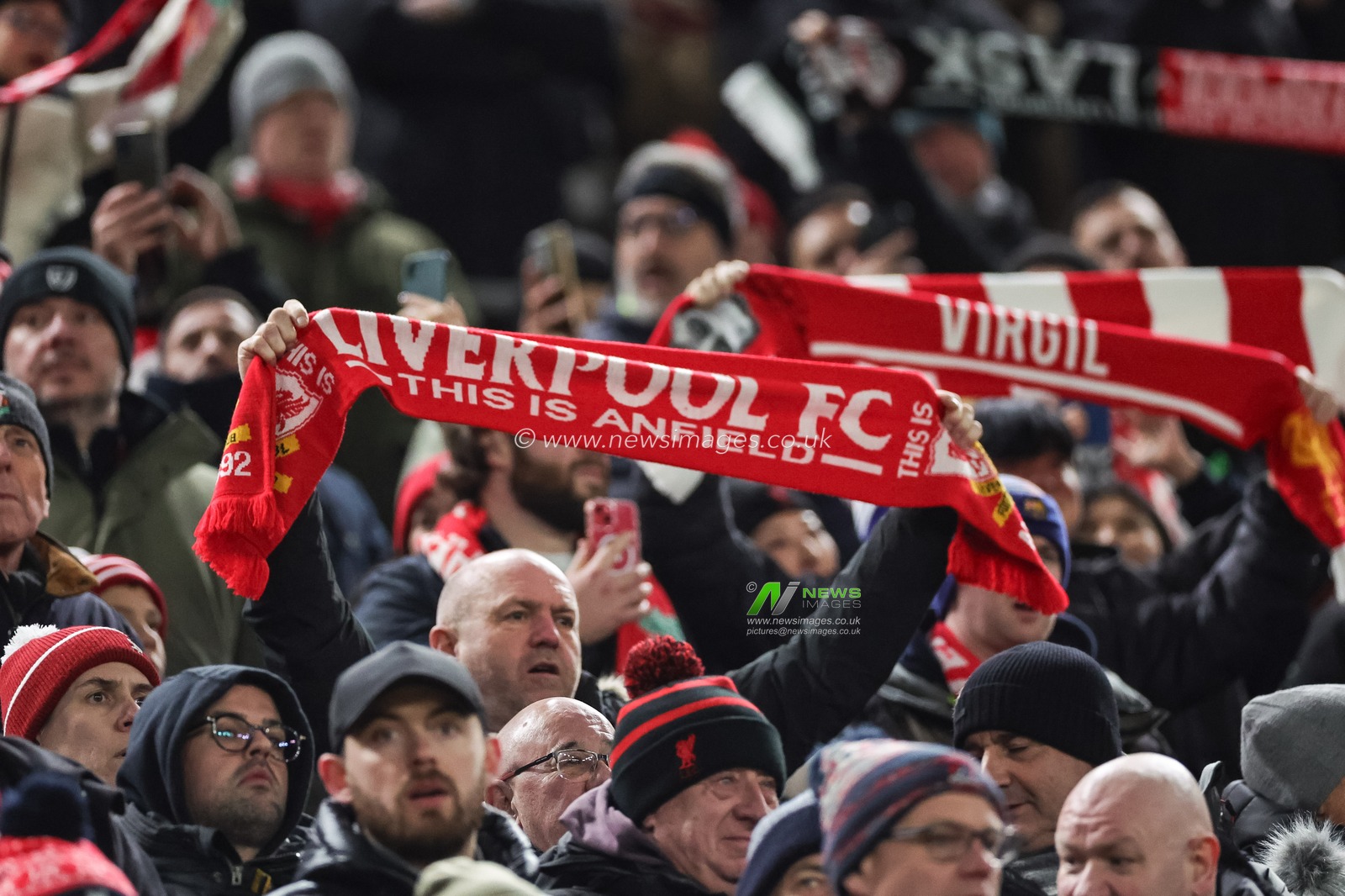 Liverpool fans hold scarfs up as they sing â€œYouâ€™ll never walk againâ€ during the UEFA Europa League match Liverpool vs LASK at Anfield, Liverpool, United Kingdom, 30th November 2023

(Photo by Mark Cosgrove/News Images)