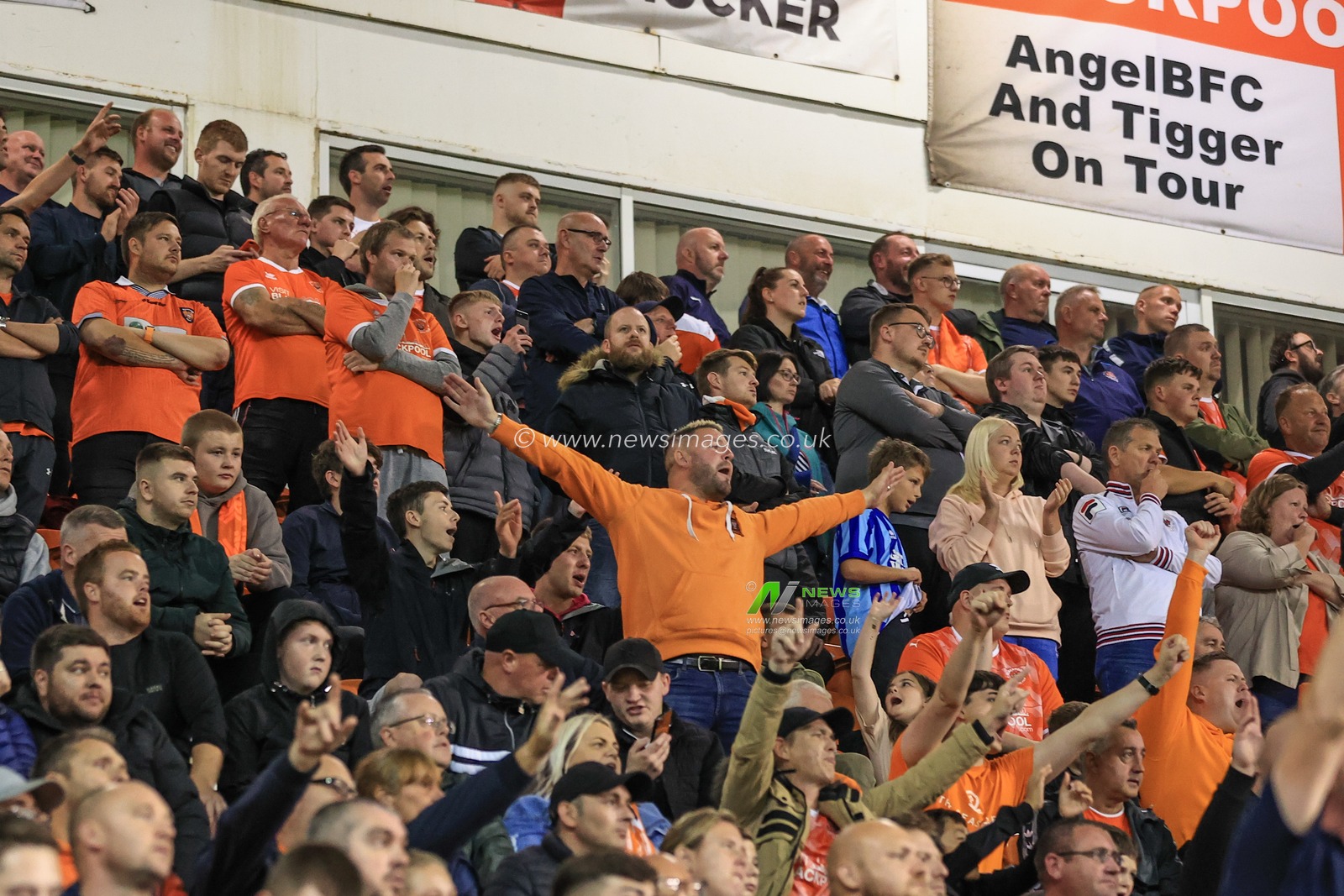 Blackpool fans celebrate their 3-0 win