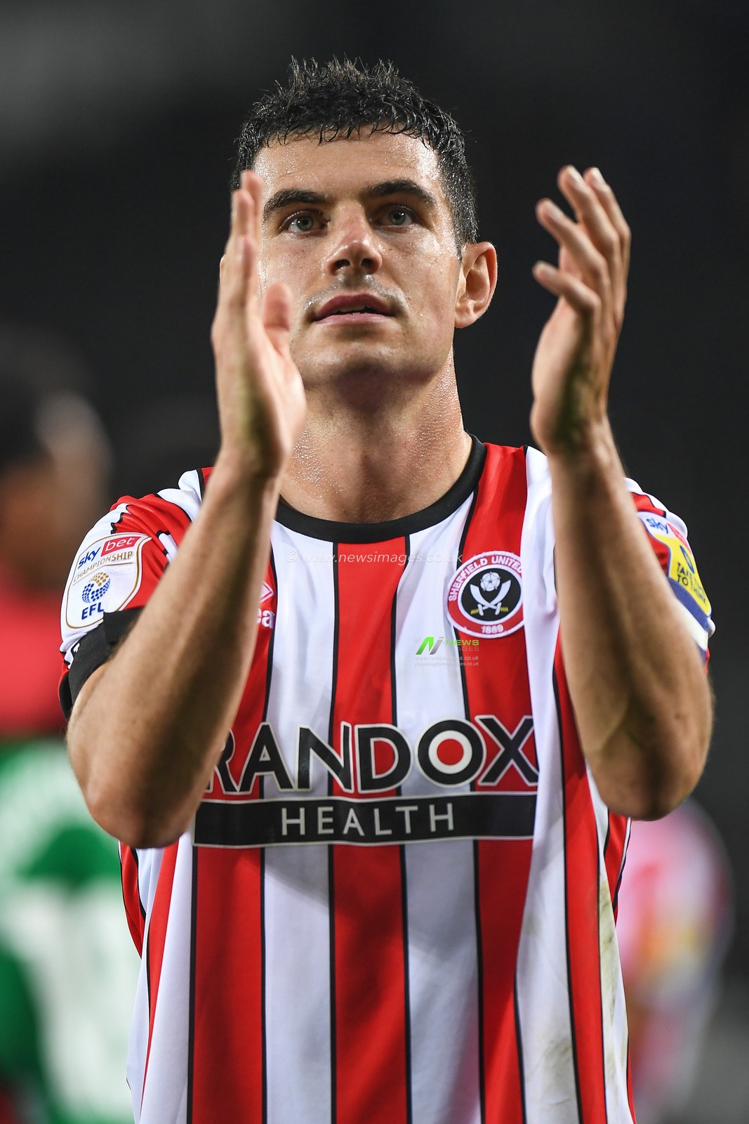 John Egan #12 of Sheffield United Applauds the travelling supportersduring the Sky Bet Championship match Swansea City vs Sheffield United at Swansea.com Stadium, Swansea, United Kingdom, 13th September 2022

(Photo by Mike Jones/News Images)