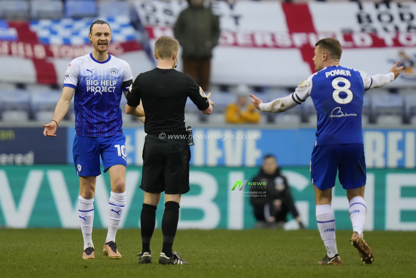 Will Keane #10 of Wigan Athletic and Max Power react to a decision of Referee Gavin Ward during the Sky Bet Championship match Wigan Athletic vs Huddersfield Town at DW Stadium, Wigan, United Kingdom, 11th February 2023

(Photo by Steve Flynn/News Images)