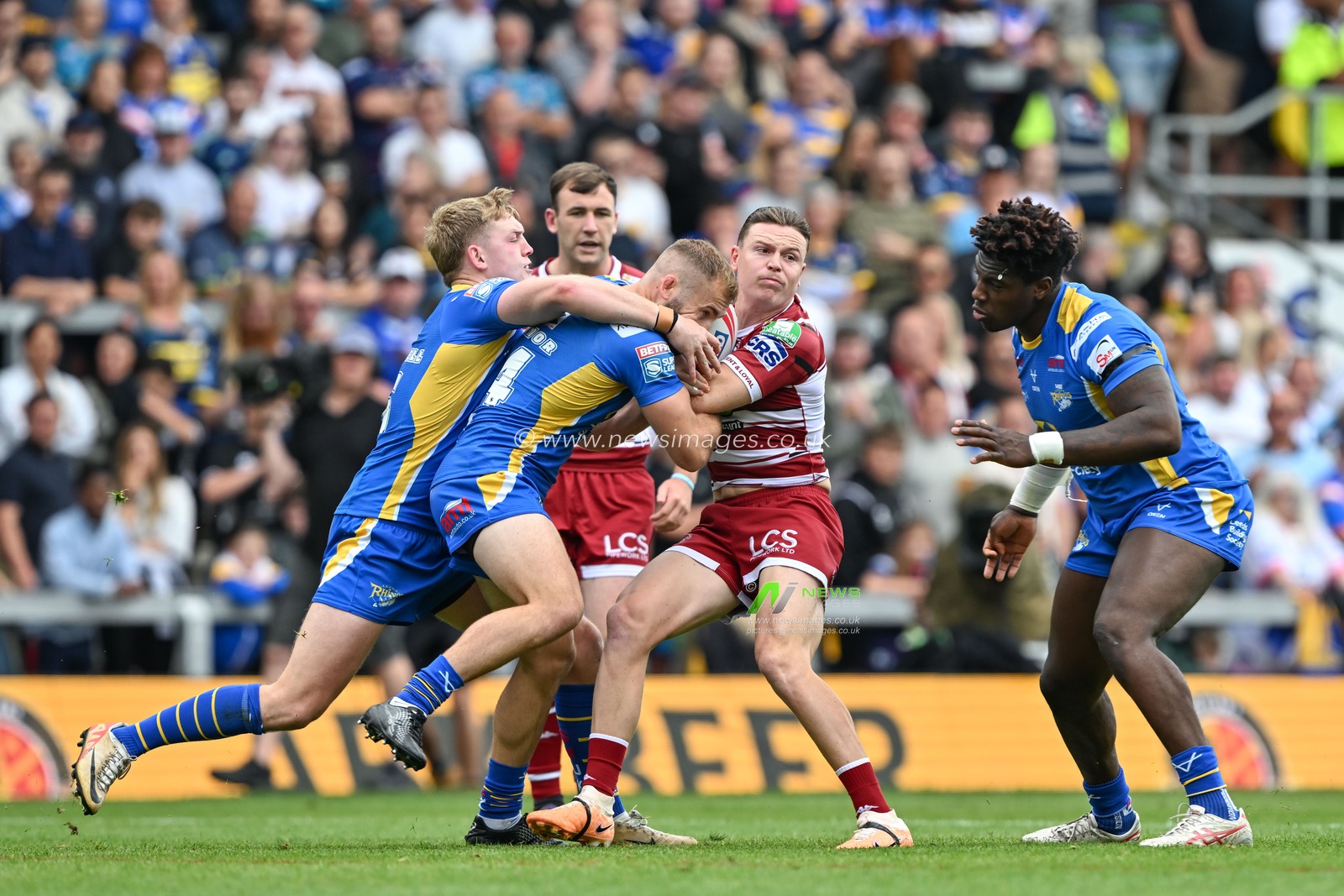 Jai Field of Wigan Warriors gets tackled during the Betfred Super League Round 21 match Leeds Rhinos vs Wigan Warriors at Headingley Stadium, Leeds, United Kingdom, 10th August 2024

(Photo by Cody Froggatt/News Images)