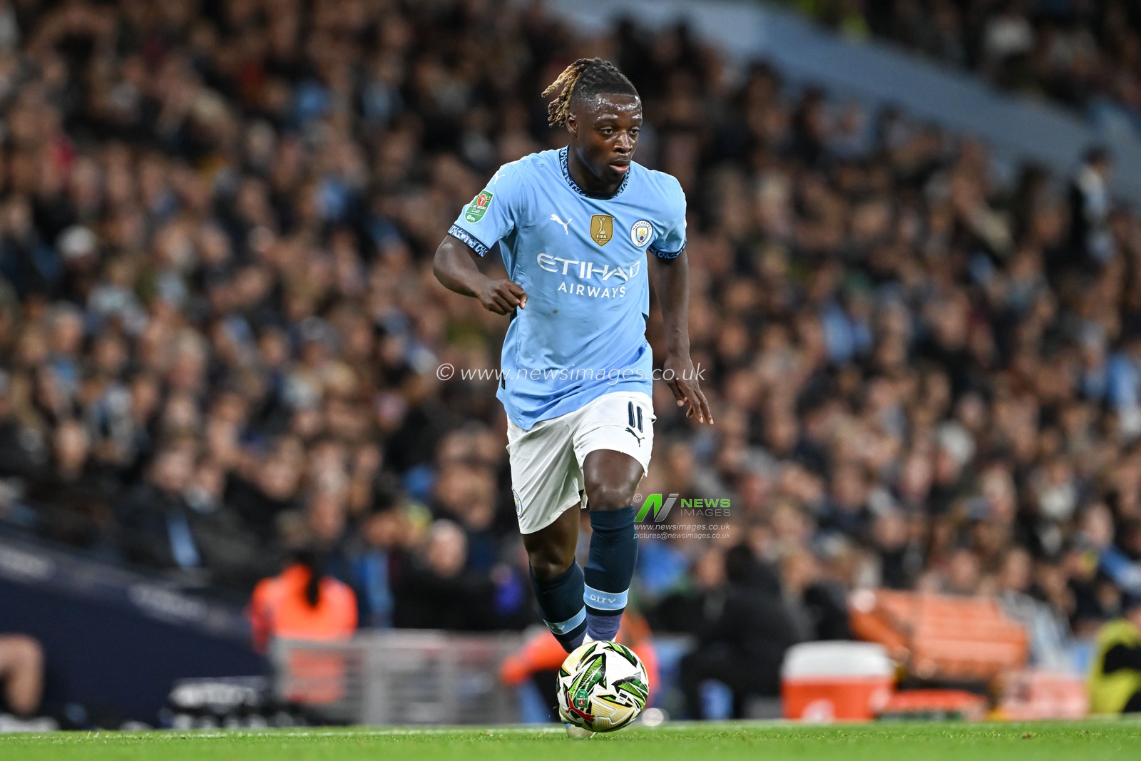 JÃ©rÃ©my Doku of Manchester City breaks forwards with the ball during the Carabao Cup match Manchester City vs Watford at Etihad Stadium, Manchester, United Kingdom, 24th September 2024

(Photo by Cody Froggatt/News Images)
