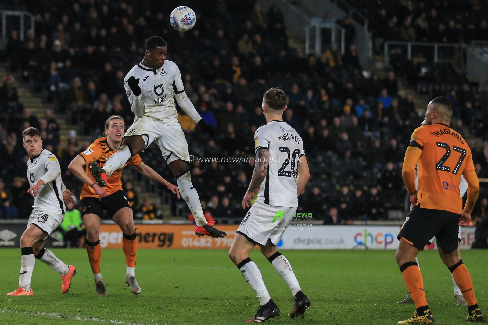 14th February 2020, KC Stadium, Kingston upon Hull, England; Sky Bet Championship, Hull City v Swansea City : Marc Guehi (2) of Swansea City gets up to head the ball away from goal