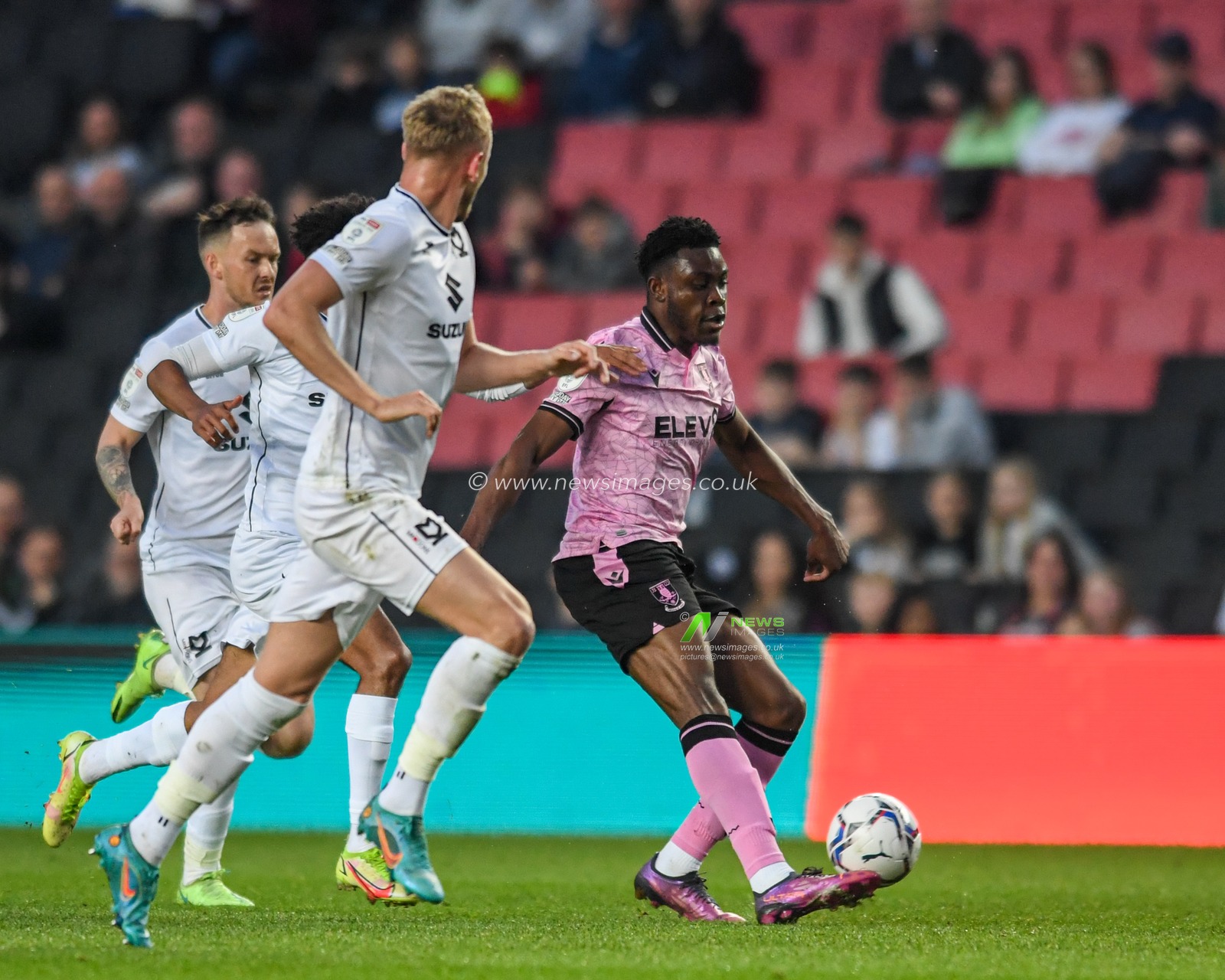 Fisayo Dele-Bashiru #17 of Sheffield Wednesday clears the ball