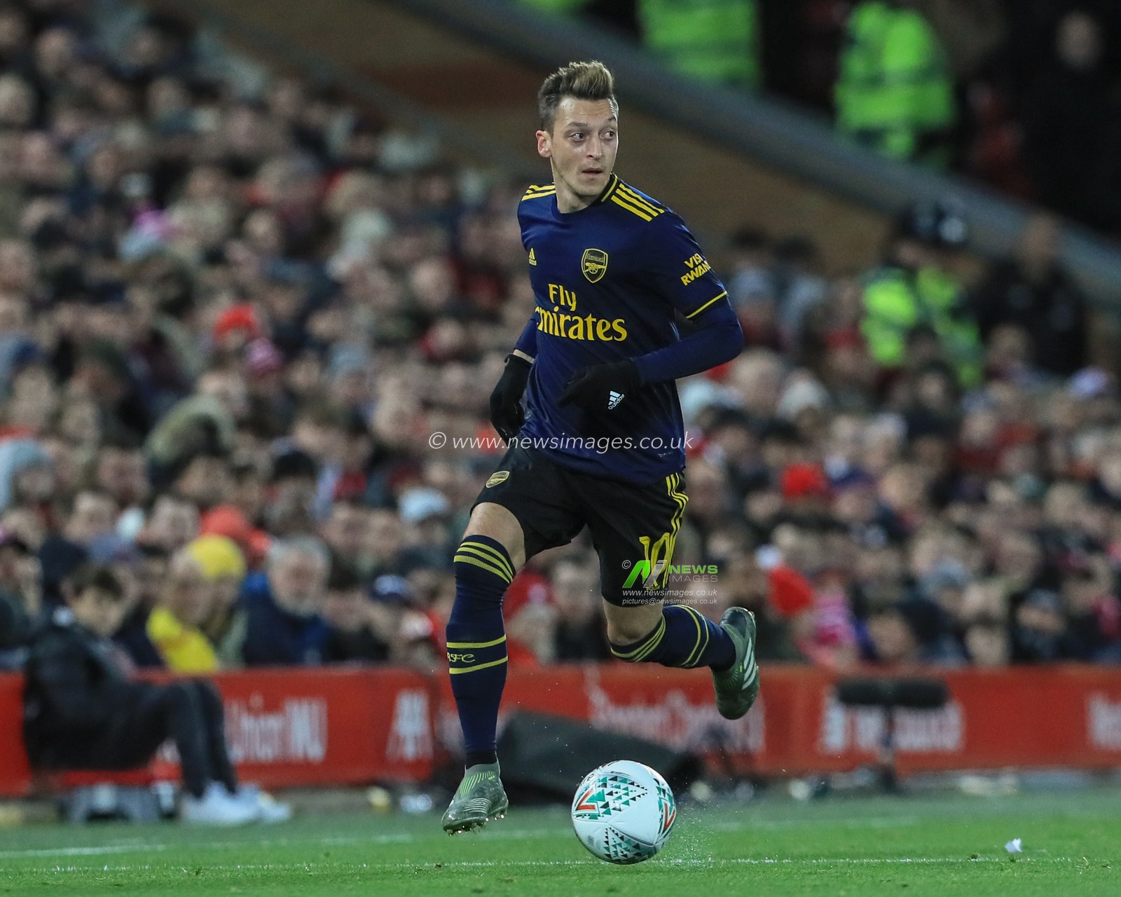 30th October 2019, Anfield, Liverpool, England; Carabao Cup, Liverpool v Arsenal : Mesut Ozil (10) of Arsenal makes a break down the wing 

Credit: Mark Cosgrove/News Images