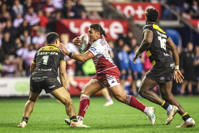 Patrick Mago of Wigan Warriors breaks with the ball under pressure from Toa Mata'afa of York Knights during the Betfred Super League round 5 match Wigan Warriors vs York Knights at The Brick Community Stadium, Wigan, United Kingdom on 19 March 2026

(Photo by Alfie Cosgrove/News Images)