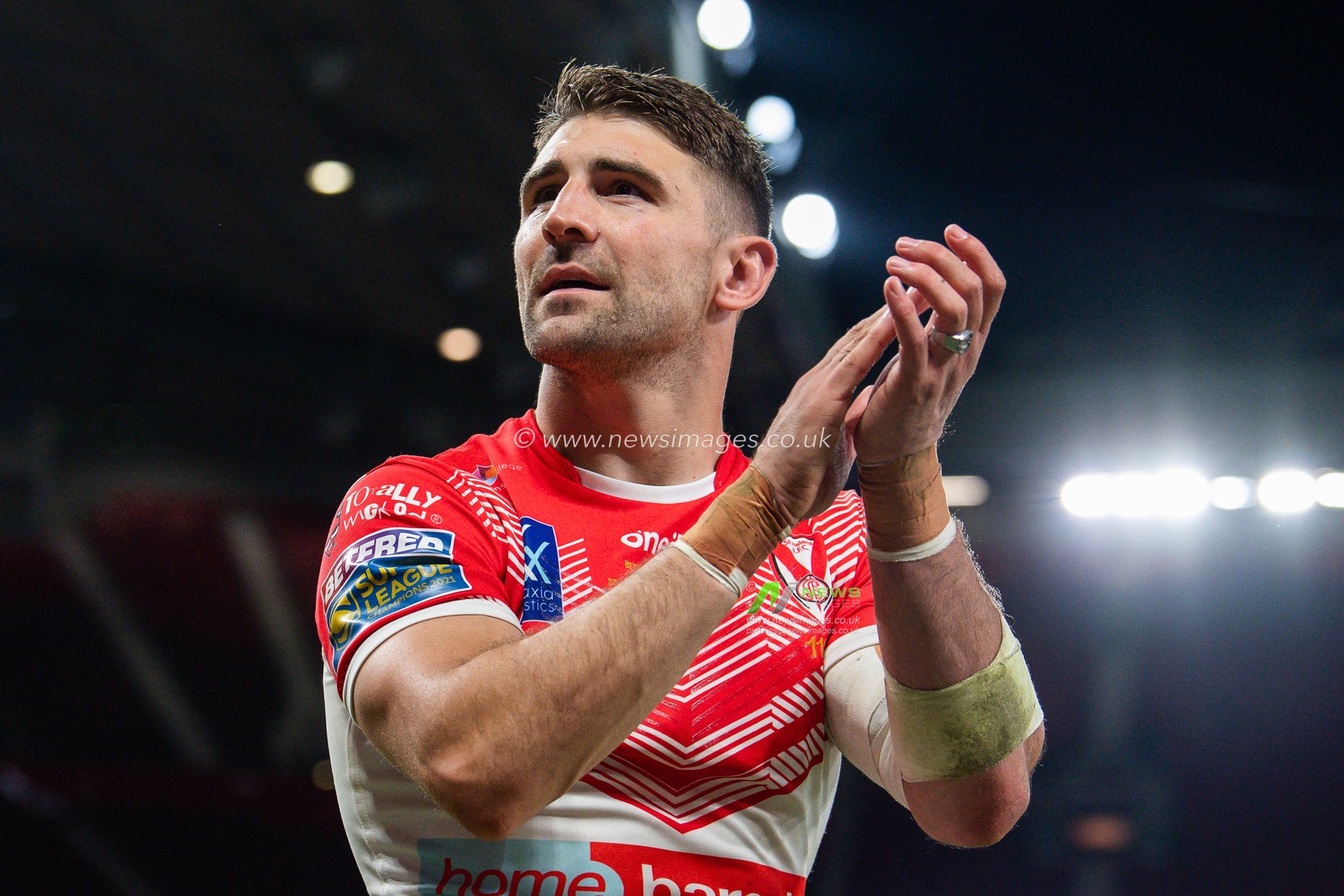 Tommy Makinson #2 of St Helens applauds the fans after winning the  25th Betfred Super League Grand Final match St Helens vs Leeds Rhinos at Old Trafford, Manchester, United Kingdom, 24th September 2022

(Photo by Craig Thomas/News Images)