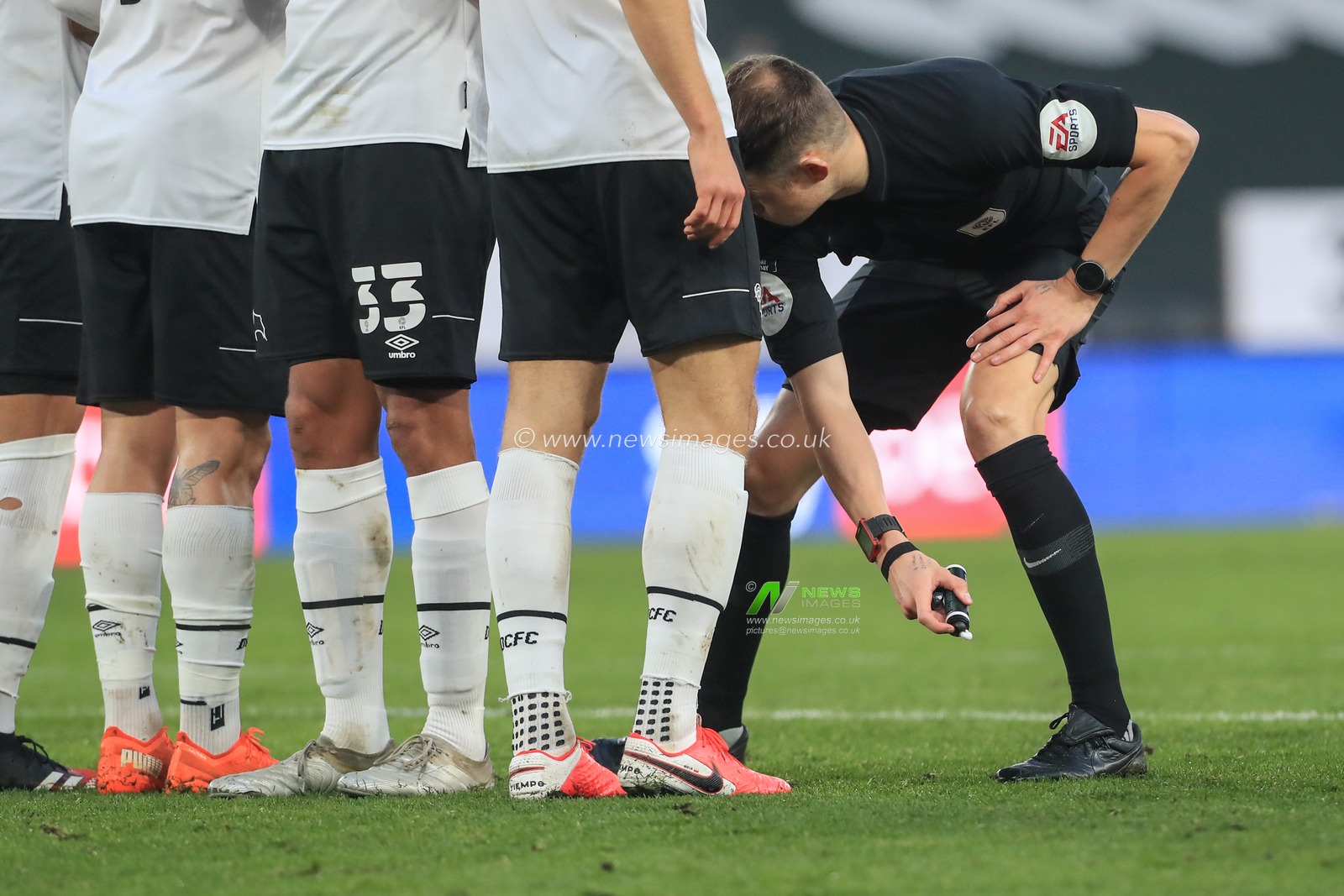 referee Leigh Doughty make the wall for a Barnsley free-kick