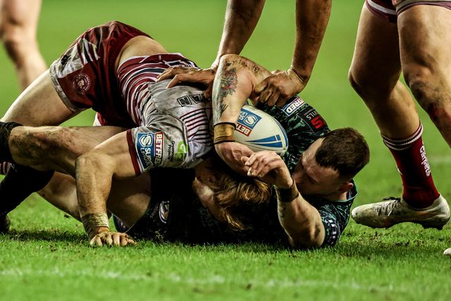 Frankie Halton of Leigh Leopards is tackled by ,Adam Keighran during the Betfred Super League match Wigan Warriors vs Leigh Leopards at The Brick Community Stadium, Wigan, United Kingdom on 26 February 2026

(Photo by Alfie Cosgrove/News Images)
