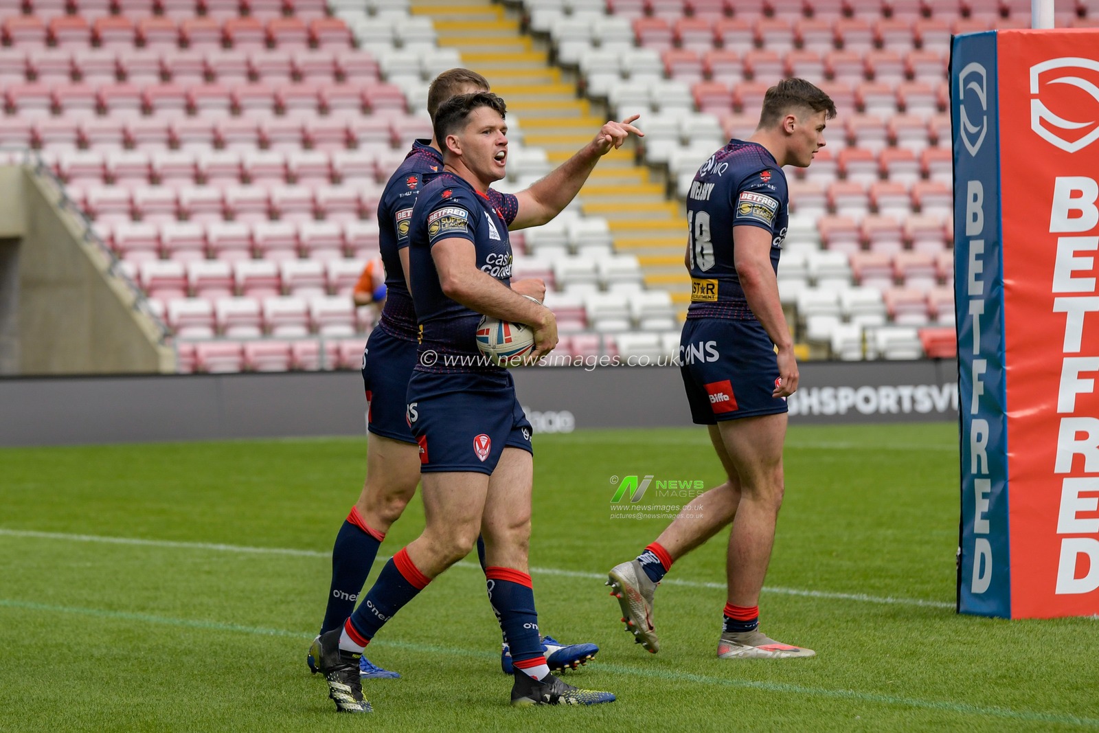 Lachlan Coote (1) of St Helens celebrates scoring a try to make it 6-10