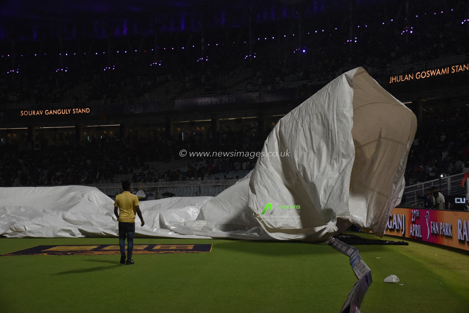 The ground staff work to keep the pitch dry as play is tries to stop the ball due to rain during the 2025 IPL match between Kolkata Knight Riders and Punjab Kings at Eden Gardens on April 26, 2025, in Kolkata, India. Photo by Debajyoti Chakraborty.(Photo: Debajyoti Chakraborty/News Images)