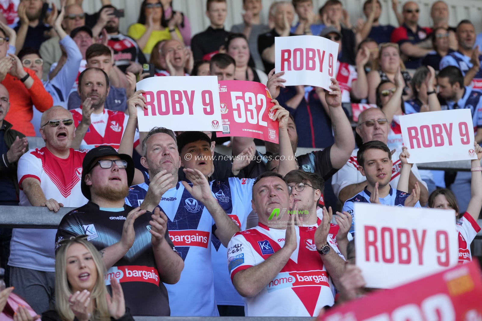 St Helens fans hold up cards with Toby 9 and 532 to mark the 532 appearance of James Roby #9 of St. Helens during the Betfred Super League Round 12 match St Helens vs Salford Red Devils at Totally Wicked Stadium, St Helens, United Kingdom, 13th May 2023

(Photo by Steve Flynn/News Images)