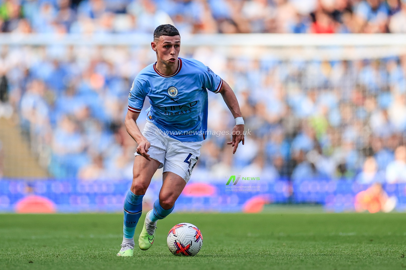 Phil Foden #47 of Manchester City with the ball during the Premier League match Manchester City vs Chelsea at Etihad Stadium, Manchester, United Kingdom, 21st May 2023

(Photo by Conor Molloy/News Images)