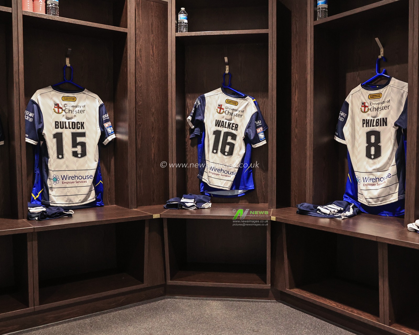 Warrington Dressing room shirts of Joe Bullock #15 of Warrington Wolves,Danny Walker #16 of Warrington Wolves and Joe Philbin #8 of Warrington Wolves