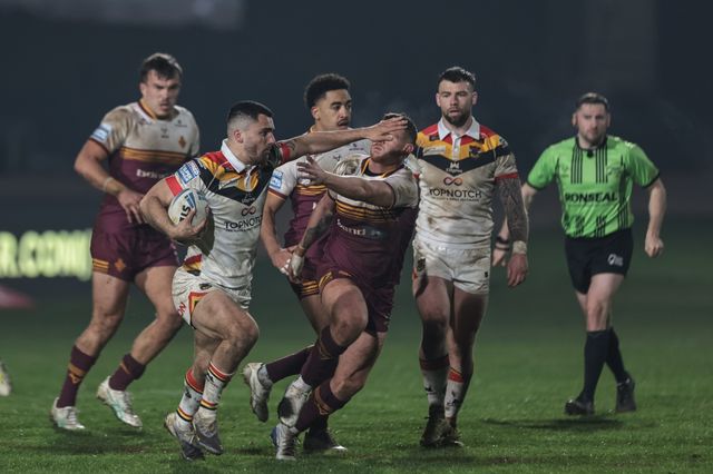 Caleb Aekins of Bradford Bulls hands-off Olly Russell of Huddersfield Giants as he breaks with the ball during the Betfred Super League Round 5 match Bradford Bulls vs Huddersfield Giants at Odsal Stadium, Bradford, United Kingdom on 20 March 2026

(Photo by Mark Cosgrove/News Images)