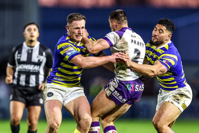 Oliver Pratt of Wakefield Trinity is tackled by Ben Currie of Warrington Wolves and Toafofoa Sipley of Warrington Wolves during the Betfred Super League Round 3 match Warrington Wolves vs Wakefield Trinity at The Halliwell Jones Stadium, Warrington, United Kingdom on 28 February 2026

(Photo by Alfie Cosgrove/News Images)