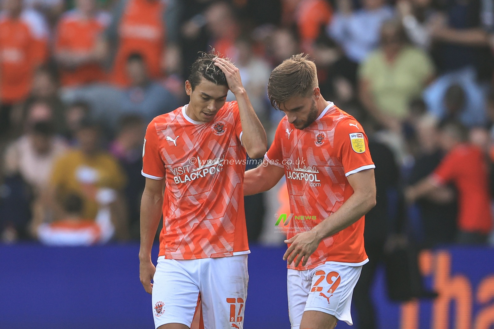 Kenny Dougall #12 of Blackpool and Luke Garbutt #29 of Blackpool celebrate the 1-0 win over Barnsley