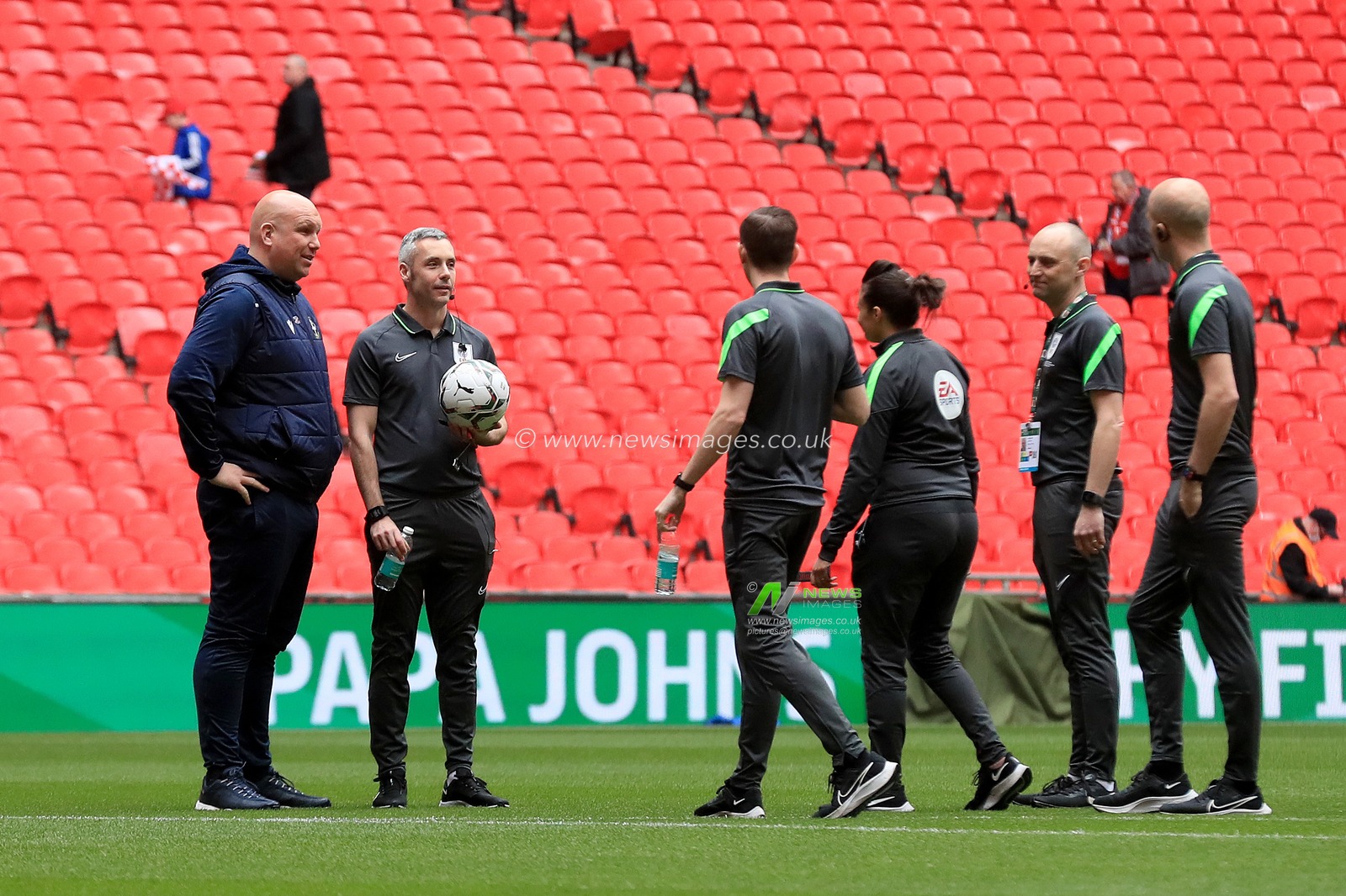 Matt Gray manager of Sutton United meets referee, Sebastian Stockbridge and his assistants.