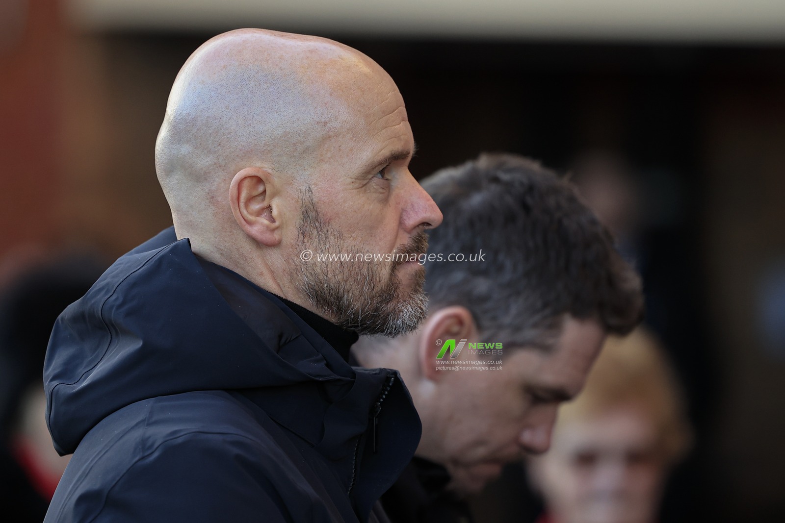 United manager Erik ten Hag looks up to the wall of floral tributes as Manchester United mark the 65th anniversary of the Munich Air Disaster at Old Trafford, Manchester, United Kingdom, 6th February 2023

(Photo by Conor Molloy/News Images)