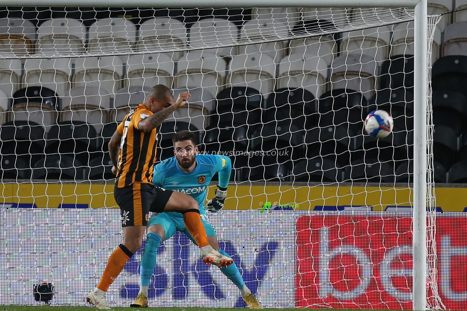 Josh Magennis #27 of Hull City clears the ball