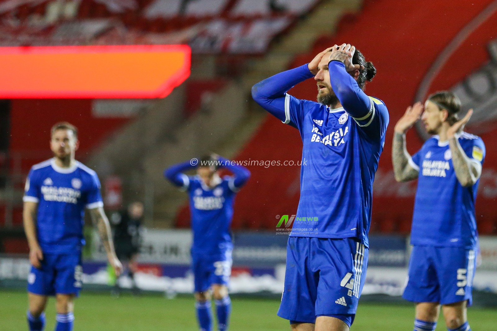 Sean Morrison #4 of Cardiff City and team-mates react during the game