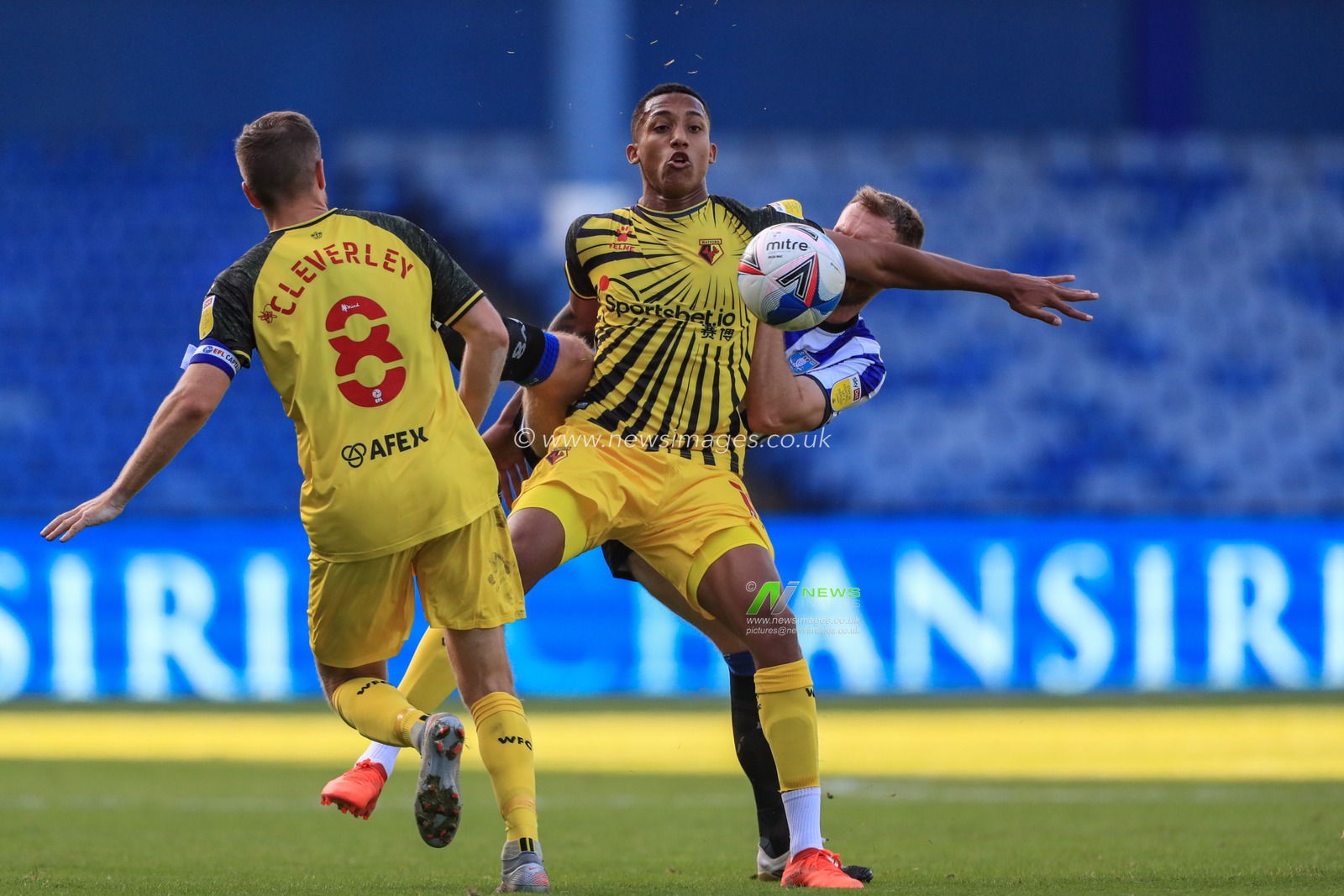 Tom Lees (15) of Sheffield Wednesday tussles with JoÃ£o Pedro (10) of Watford
