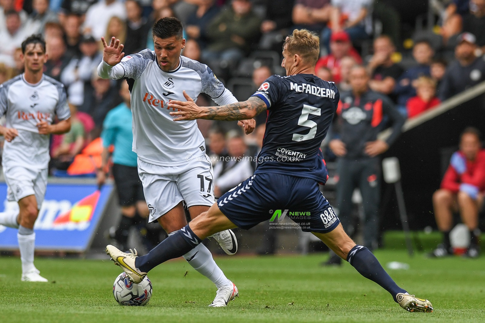JoÃ«l Piroe #17 of Swansea City takes on Kyle McFadzean #5 of Coventry City during the Sky Bet Championship match Swansea City vs Coventry City at Swansea.com Stadium, Swansea, United Kingdom, 19th August 2023

(Photo by Mike Jones/News Images)