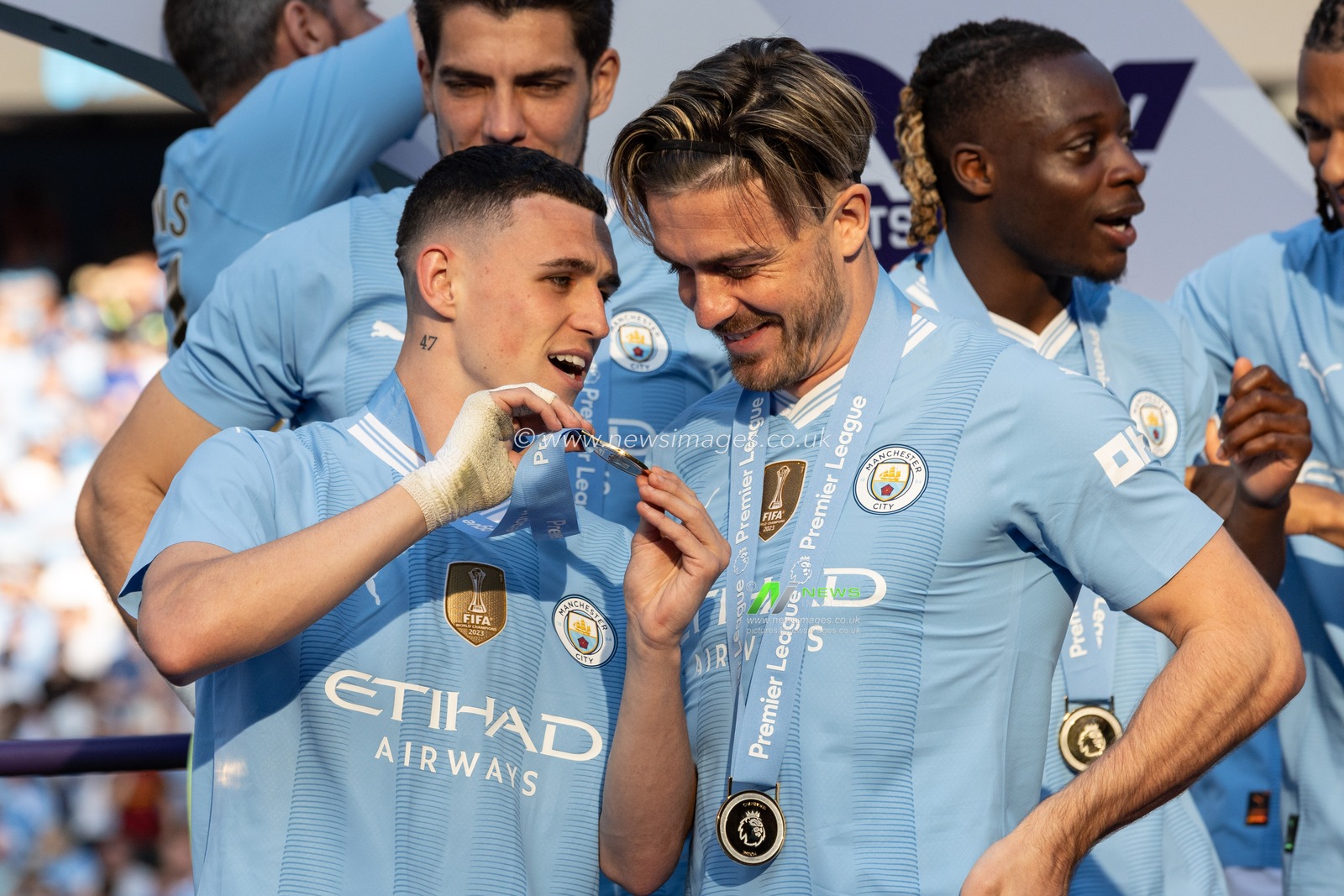 Phil Foden of Manchester City shows Jack Grealish of Manchester City his Premier League winners medal during the Premier League match Manchester City vs West Ham United at Etihad Stadium, Manchester, United Kingdom, 19th May 2024

(Photo by Mark Cosgrove/News Images)