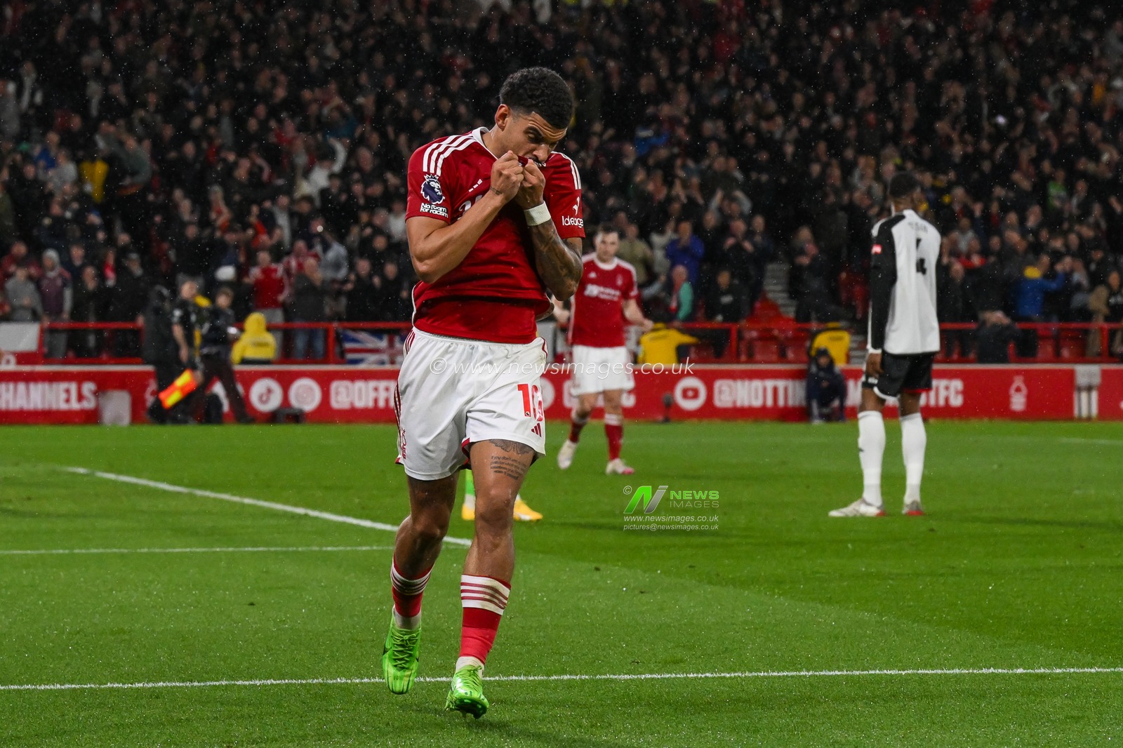 Morgan Gibbs-White of Nottingham Forest kisses the badge on his shirt as he celebrates his goal to make it 2-0 during the Premier League match Nottingham Forest vs Fulham at City Ground, Nottingham, United Kingdom, 2nd April 2024

(Photo by Craig Thomas/News Images)