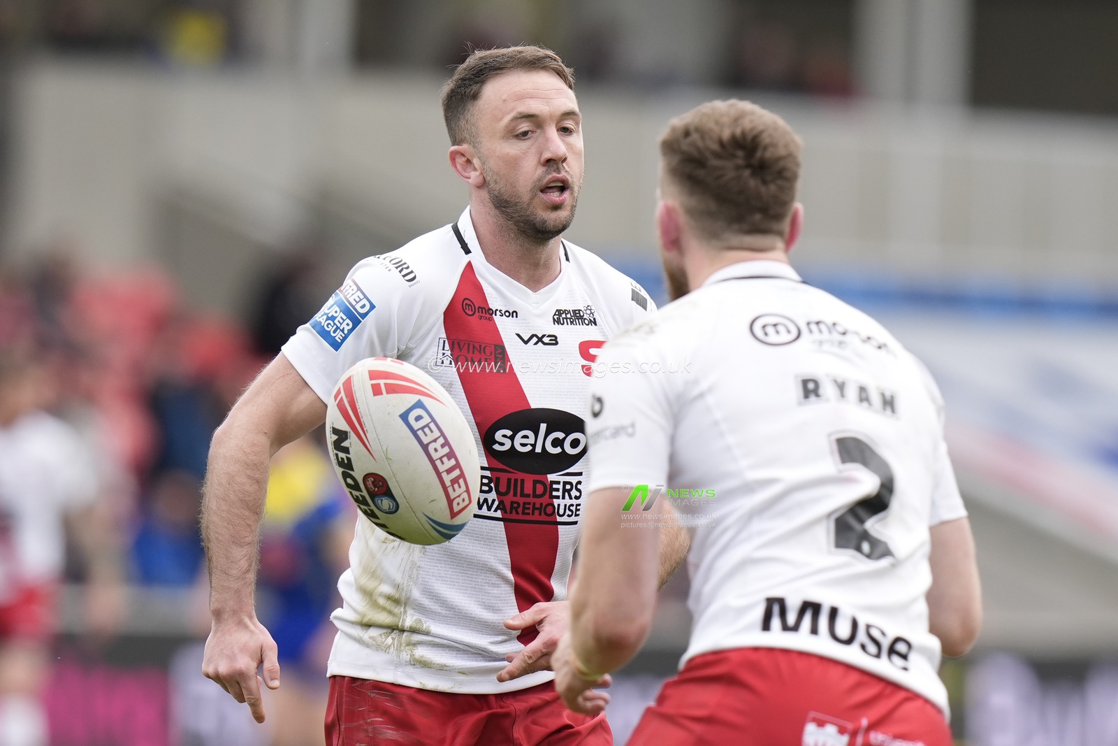 Ryan Brierley of Salford Red Devils passes the ball to Ethan Ryan of Salford Red Devils during the Betfred Super League Round 9 match Salford Red Devils vs Warrington Wolves at Salford Community Stadium, Eccles, United Kingdom, 27th April 2024

(Photo by Steve Flynn/News Images)