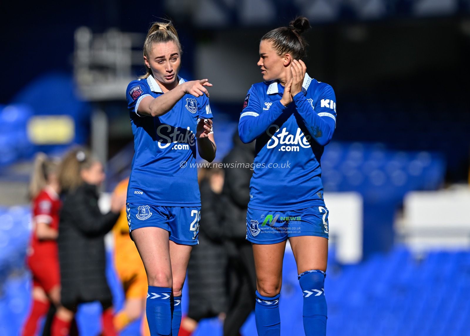 Megan Finnigan of Everton Women and Katrine Veje of Everton Women claps fans at full time, during The FA Women's Super League match Everton Women vs Liverpool Women at Goodison Park, Liverpool, United Kingdom, 24th March 2024

(Photo by Cody Froggatt/News Images)