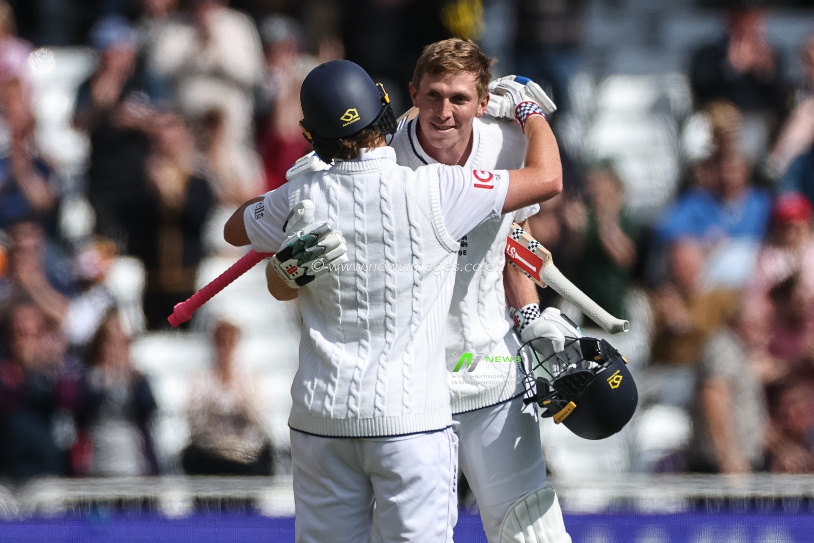Zak Crawley of England celebrates a century (100 runs) with Ollie Pope of England during the Rothesay Test Match Day 1 England vs Zimbabwe at Trent Bridge, Nottingham, United Kingdom, 22nd May 2025

(Photo by Mark Cosgrove/News Images)