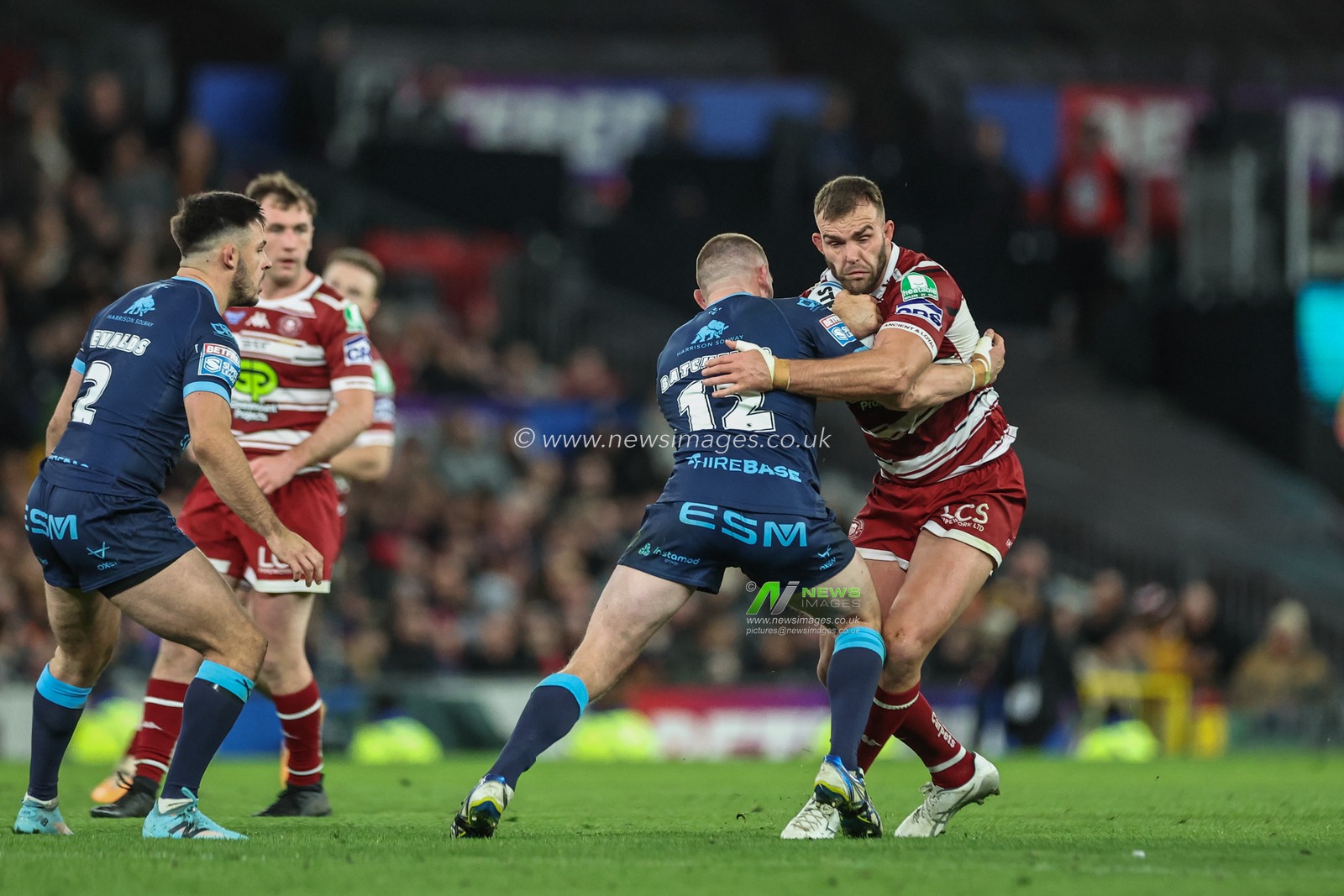 Kaide Ellis of Wigan Warriors is tackled by James Batchelor of Hull KR during the Betfred Super League Grand Final match Wigan Warriors vs Hull KR at Old Trafford, Manchester, United Kingdom, 12th October 2024

(Photo by Mark Cosgrove/News Images)