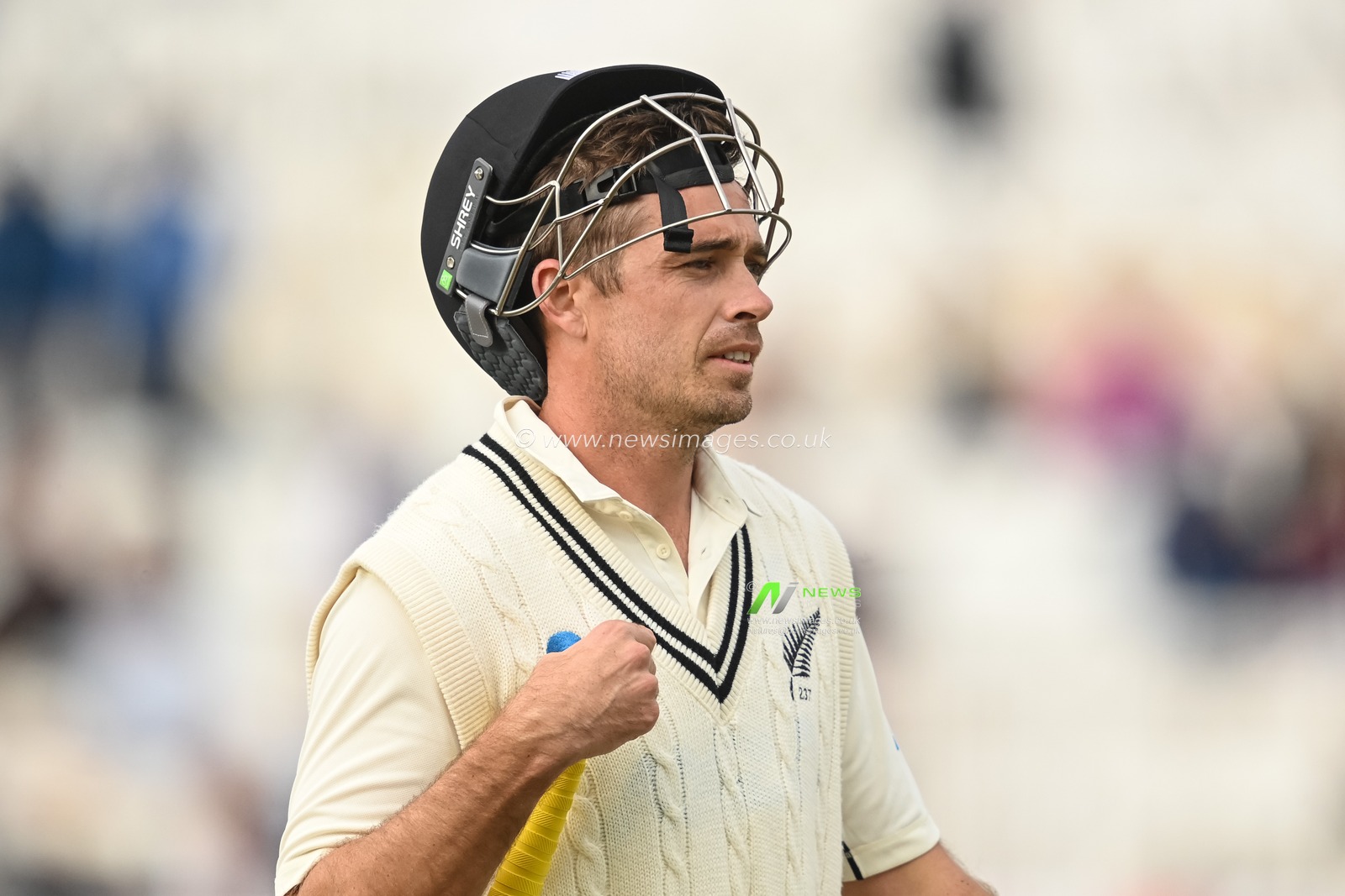 Tim Southee of New Zealand leaves the field after been run out