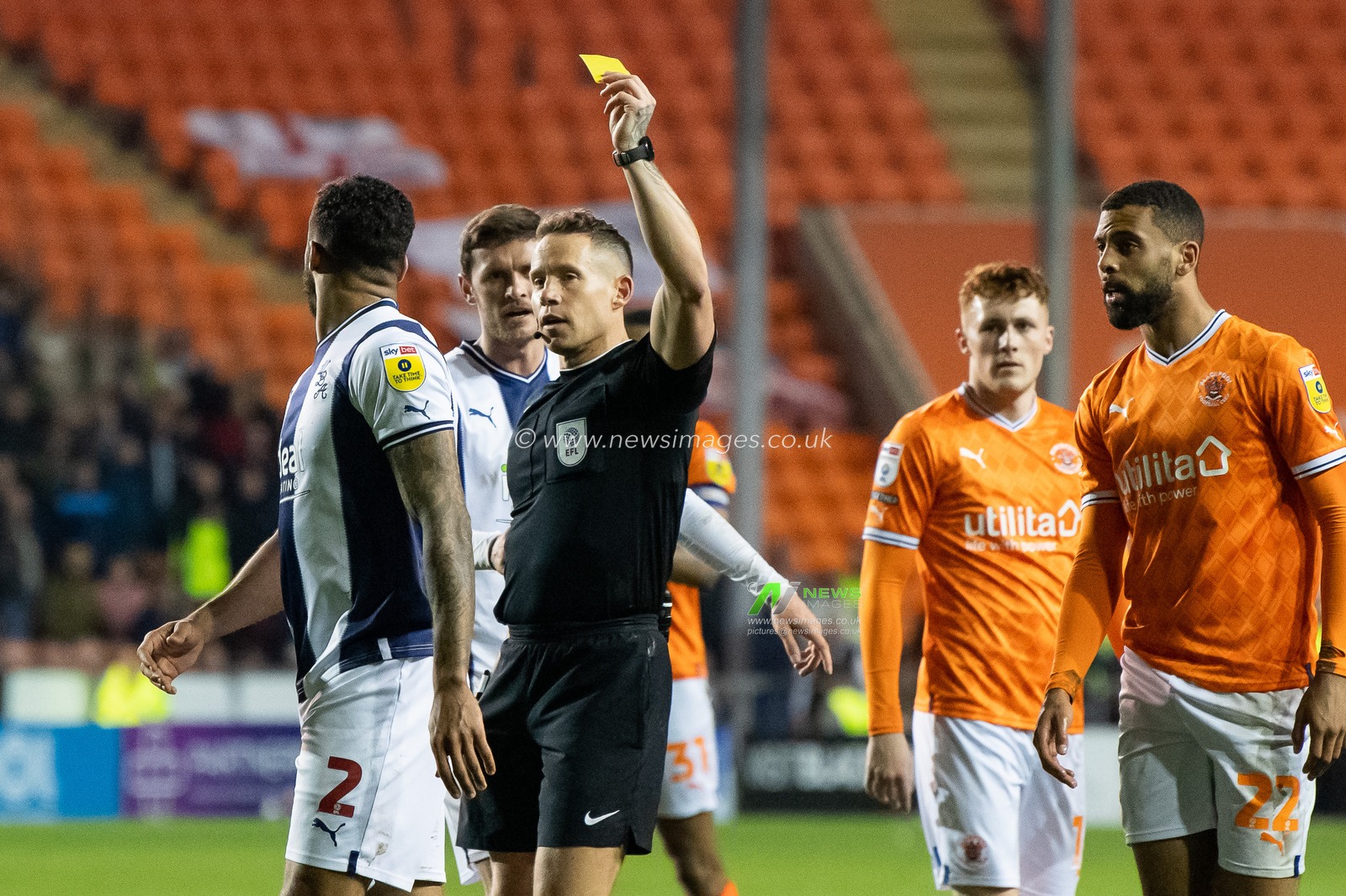 Referee Stephen Martin gives a yellow card to Darnell Furlong #2 of West Bromwich Albion during the Sky Bet Championship match Blackpool vs West Bromwich Albion at Bloomfield Road, Blackpool, United Kingdom, 18th April 2023

(Photo by Craig Thomas/News Images)