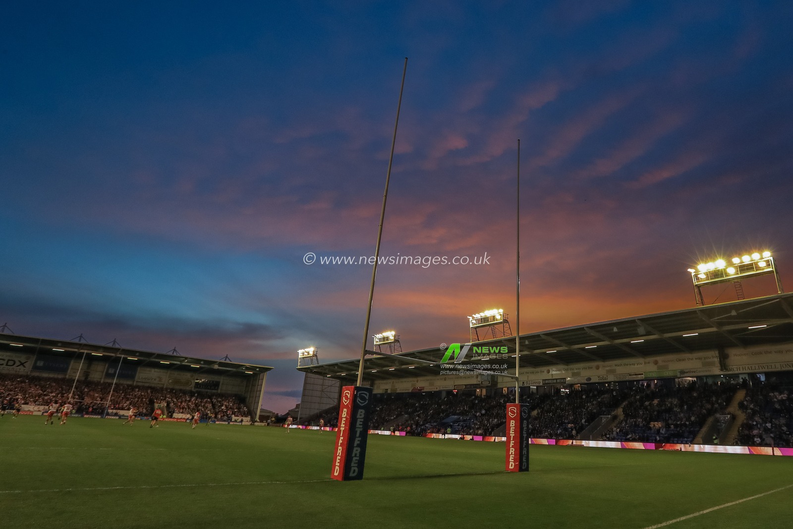 A sunset over the Halliwell Jones Stadium during the game