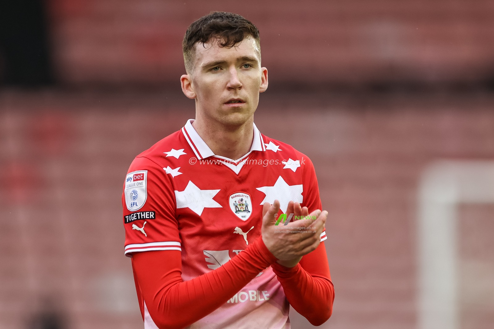 Conor Grant of Barnsley applauds the home fans during the Sky Bet League 1 match Barnsley vs Cheltenham Town at Oakwell, Barnsley, United Kingdom, 16th March 2024

(Photo by Mark Cosgrove/News Images)